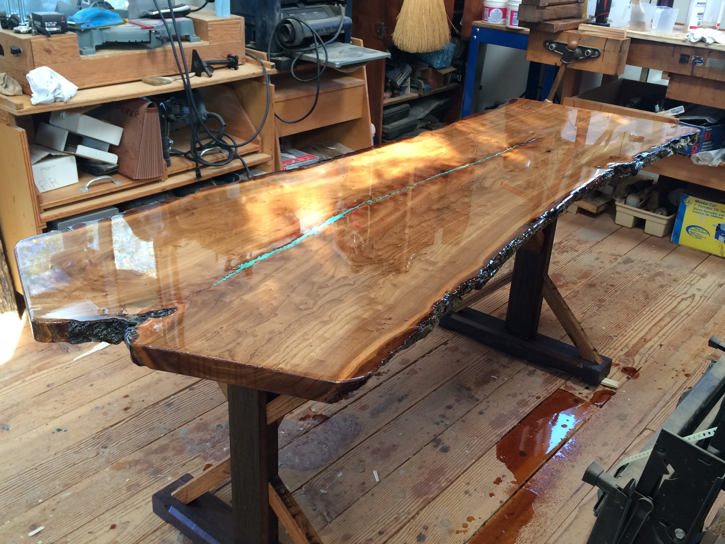 This magnificent elm slab with a beautiful live edge is a table top project designed and completed by one of our customers. The elm slab table top is a work of art with the turquoise streaming through the middle. U.S. Reclaimed, Vintage Lumber & Wood Works offers a variety of extraordinary slab pieces. You can visit the store to check out our selection and start your own project or have our team build a custom piece made just for you.