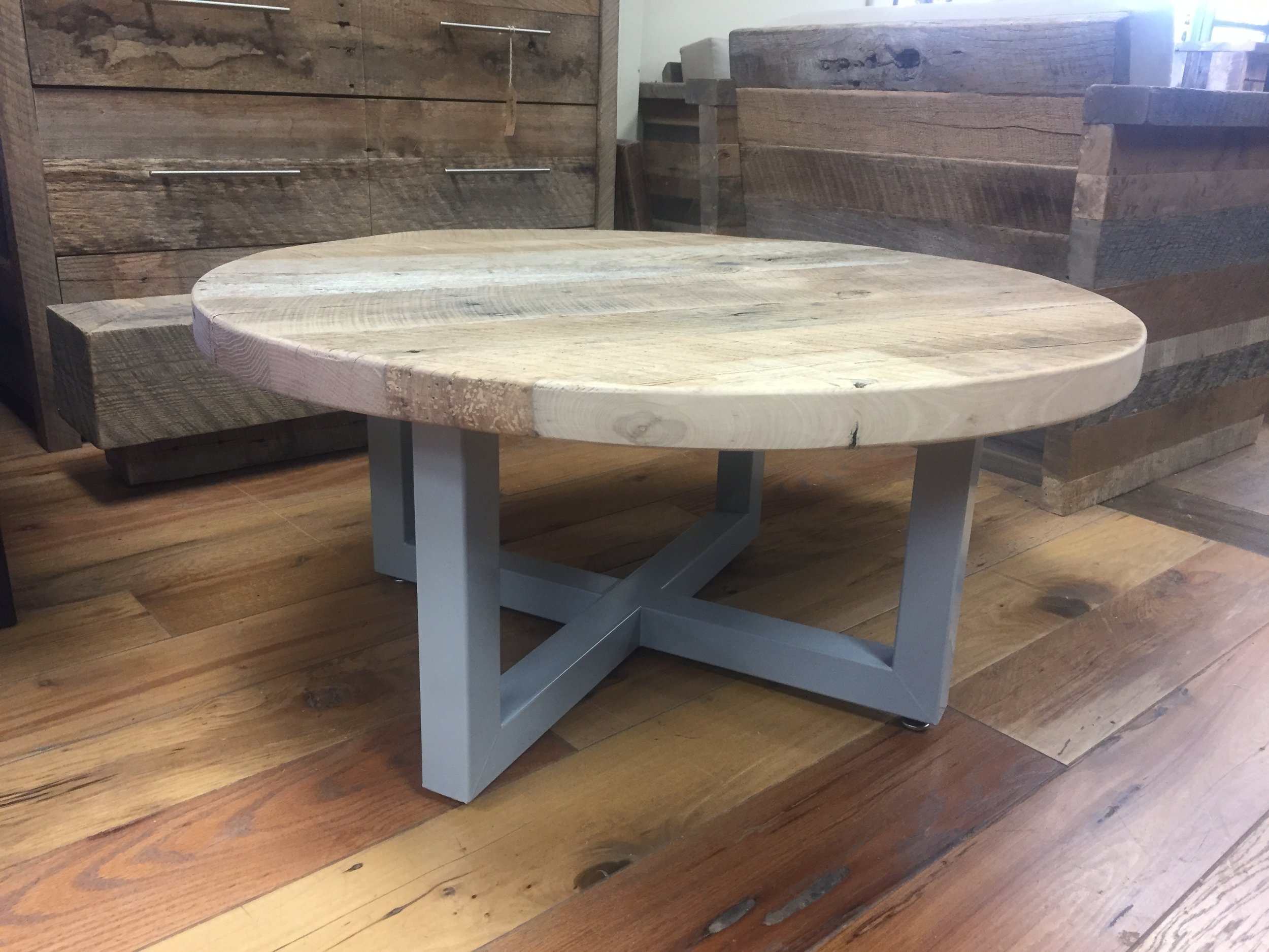 U.S. Reclaimed, Vintage Lumber & Wood Works builds custom furniture made to order based on the designs and ideas of the customer. The furniture can range from completely reclaimed wood pieces to reclaimed wood mixed with metal designs. The table pictured has a metal base with a one of a kind reclaimed wood top. Contact or visit the store to get started on a custom piece of reclaimed wood furniture. 
