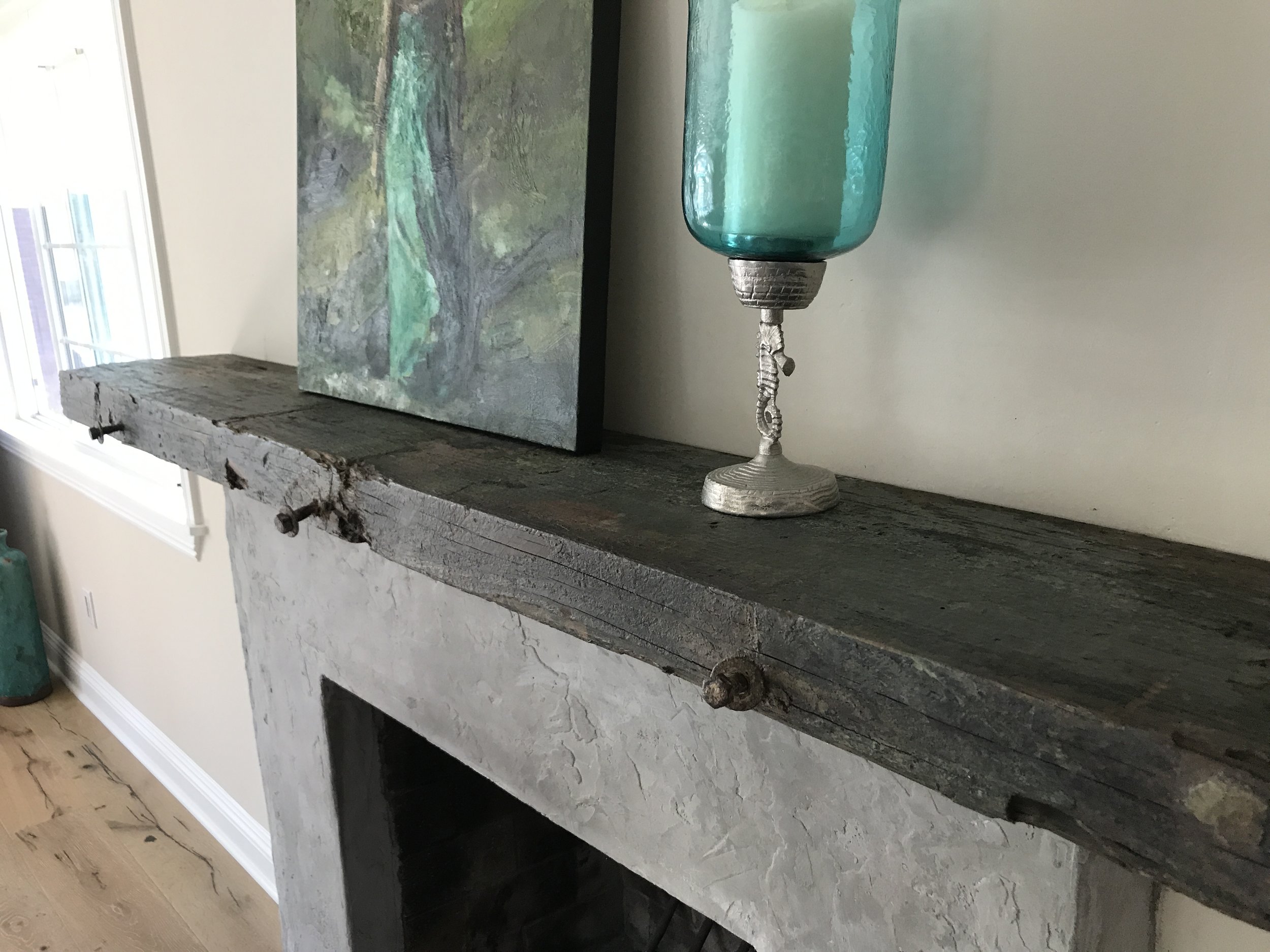 The beautiful colors of the ocean make this reclaimed wood mantel extremely unique. The customer chose a mantel from our selection of reclaimed barge wood out of San Diego, California. U.S. Reclaimed, Vintage Lumber & Wood Works offers a variety of mantel options. The possibilities are endless with vintage lumber material!