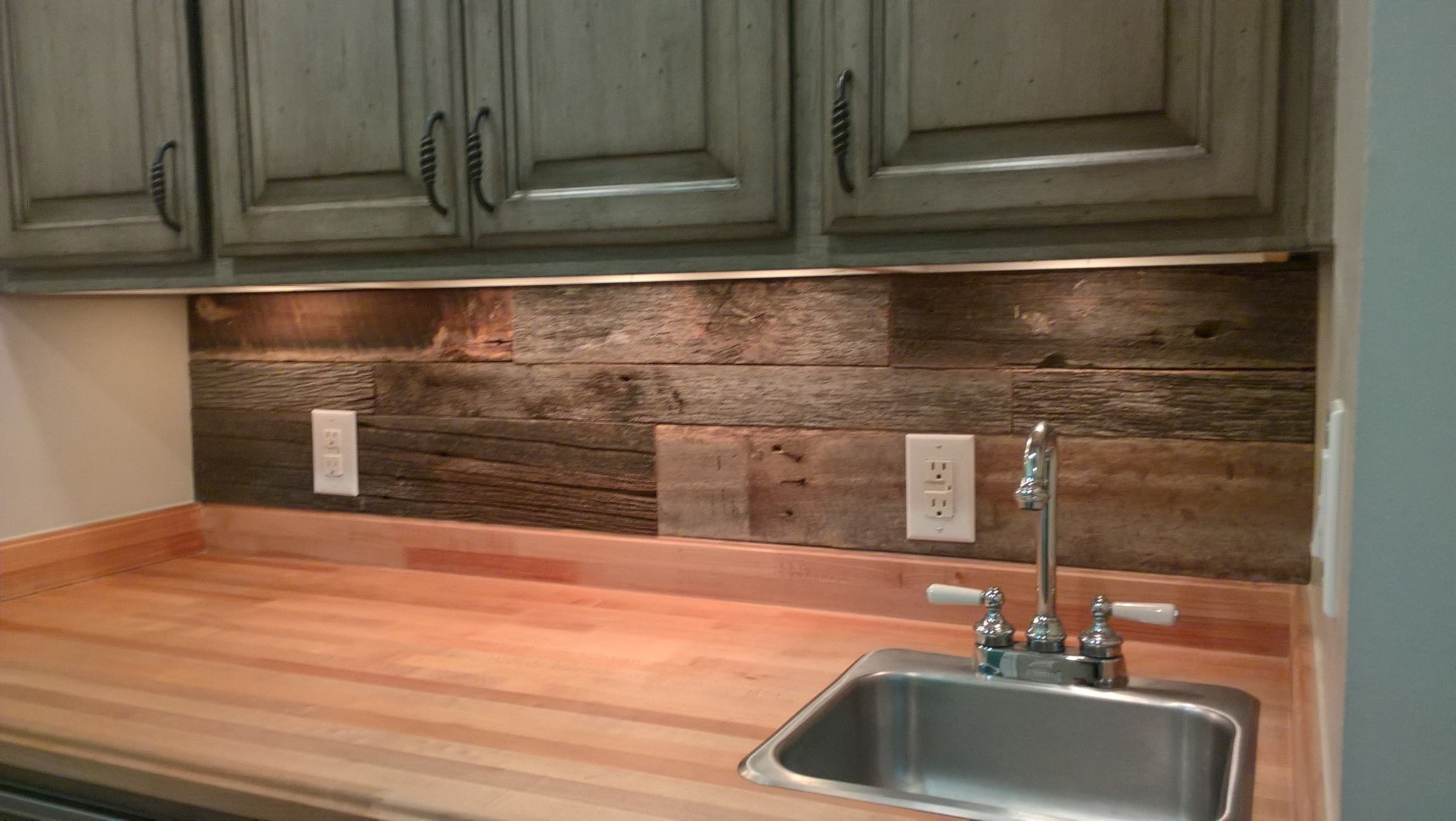 Reclaimed Wood can create a great accent wall to any space. The above picture is a wonderful example of how a little vintage lumber goes a long way. U.S. Reclaimed, Vintage Lumber & Wood Works offers the reclaimed wood needed to panel an accent wall. Visit the store to check out our reclaimed material. 