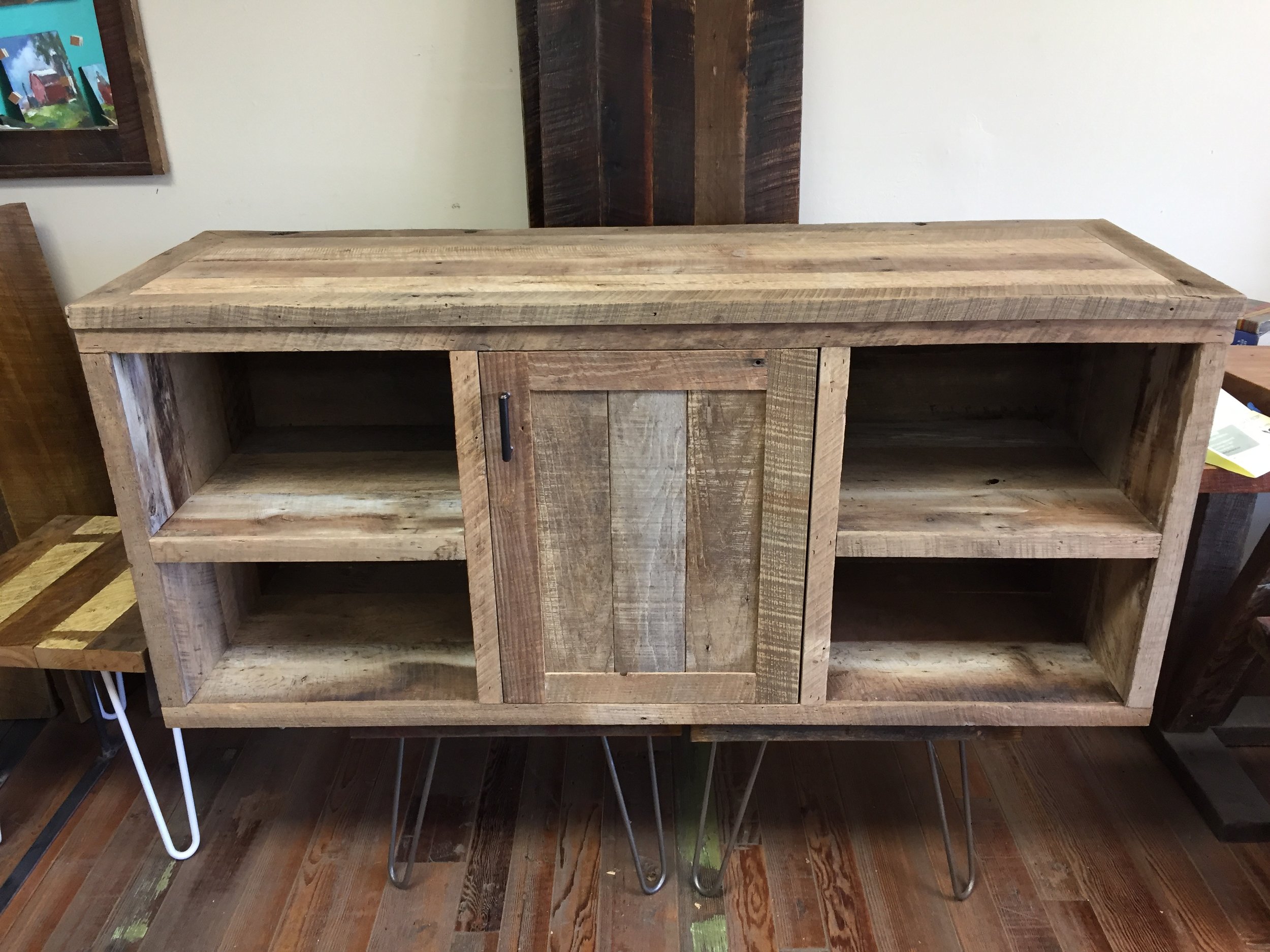U.S. Reclaimed, Vintage Lumber & Wood Works specializes in custom designs and builds. The entertainment unit pictured above is a recent custom furniture build using our reclaimed vintage lumber. Entertainment centers, and all furniture, are designed and built based on the customers desires. Contact or visit our store today to get started on a custom piece of furniture.