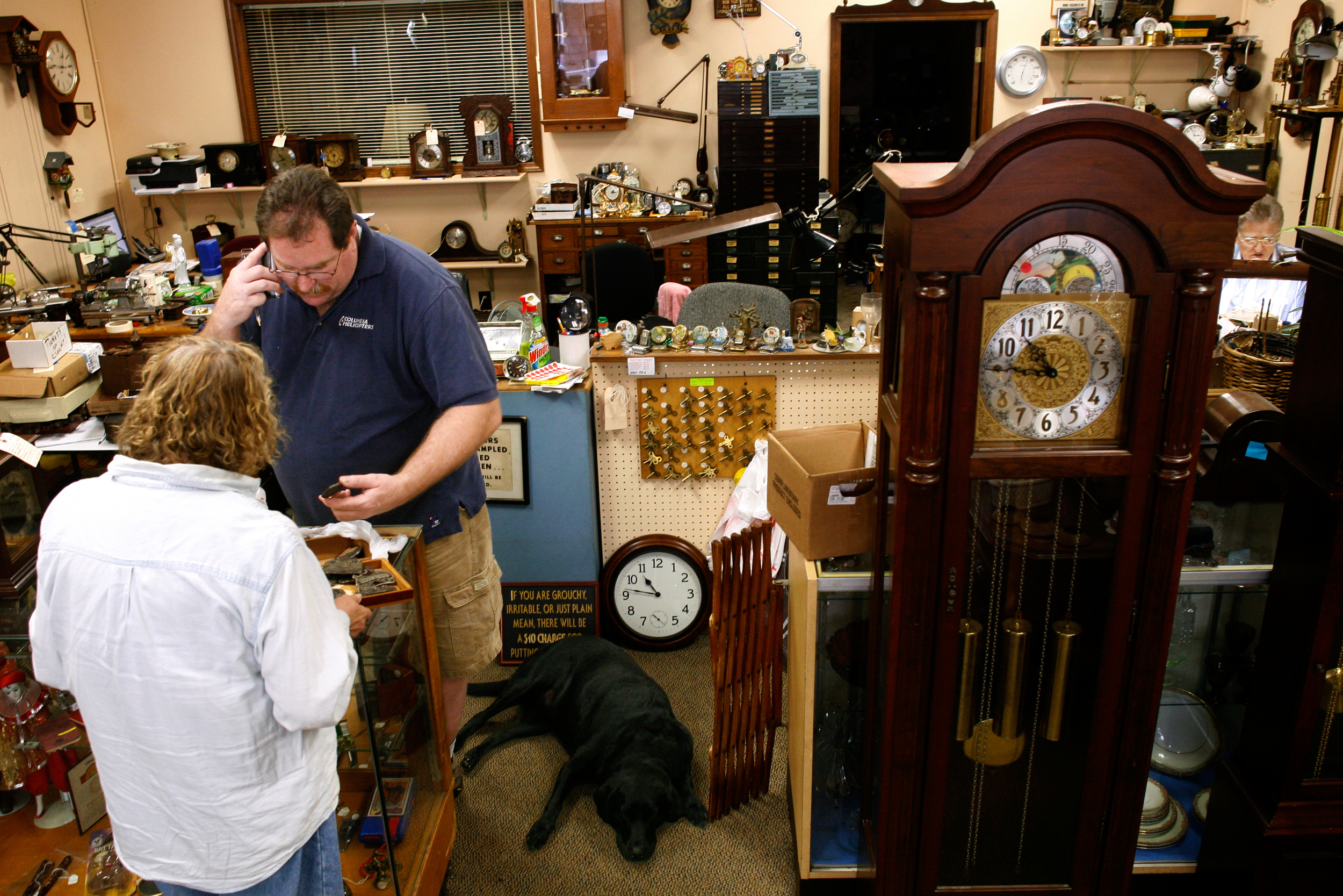 “You’re happy when you’re doing [clock repairs] now, ‘cause you’re doing it just for fun,” Mike Graham told his father while they worked in the shop. Mike is taking over the business: juggling phone calls, retail transactions, taking repair orders a