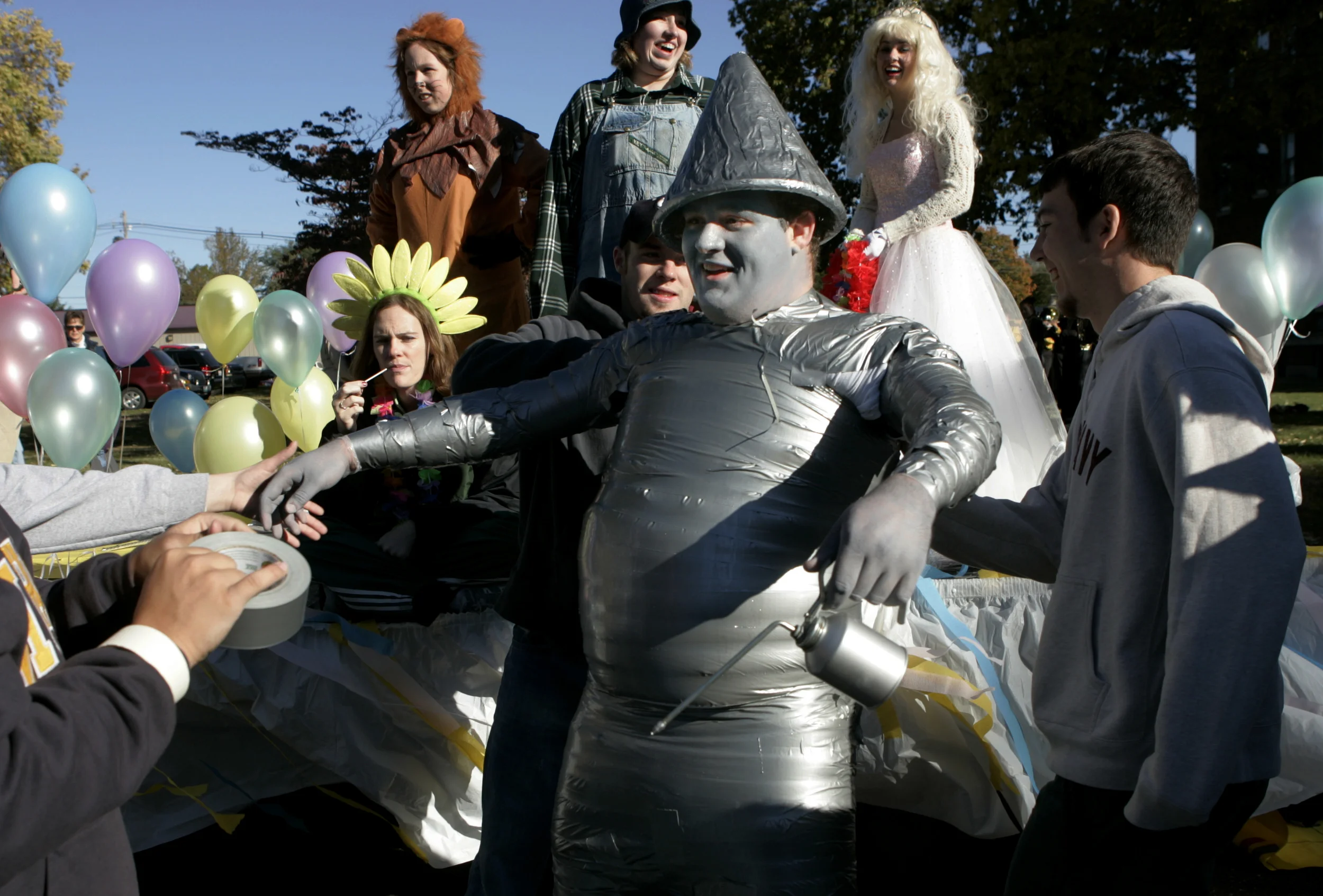  While a Tin Man costume made entirely out of duct tape may seem like a good idea, Nick Kennedy found that his head-to-toe costume considerably restricted his range of motion. Friends of Mr. Kennedy caught him from falling backward before the start o