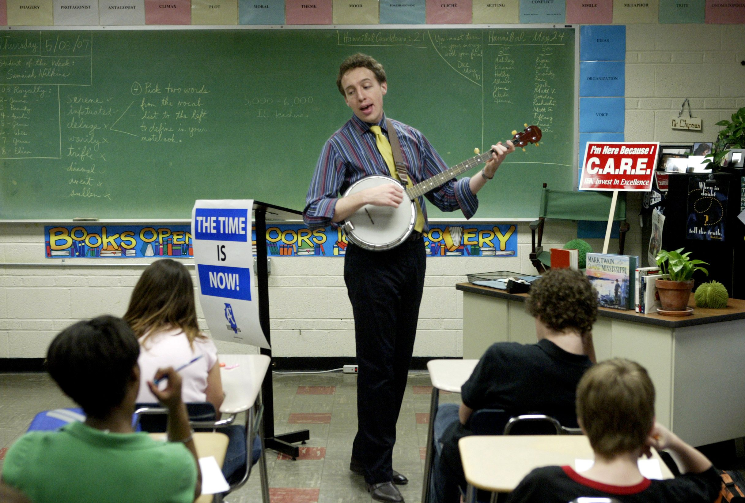  Seventh grade English teacher, Tim Chipman shows off his banjo skills while teaching the class a song related to the story of Tom Sawyer. The seventh grade at Turner will be visiting Hannibal, Mo.&nbsp;at the end of the school year to learn more abo