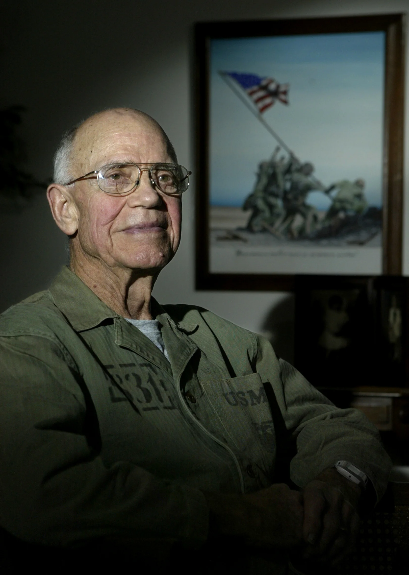  Marine Warren Musch landed on Iwo Jima on the first day of the invasion, Feb. 19, 1945. He spent 36 days on the island as a combat intelligence officer. He’s pictured in the battle uniform that he can still wear at age 85. 