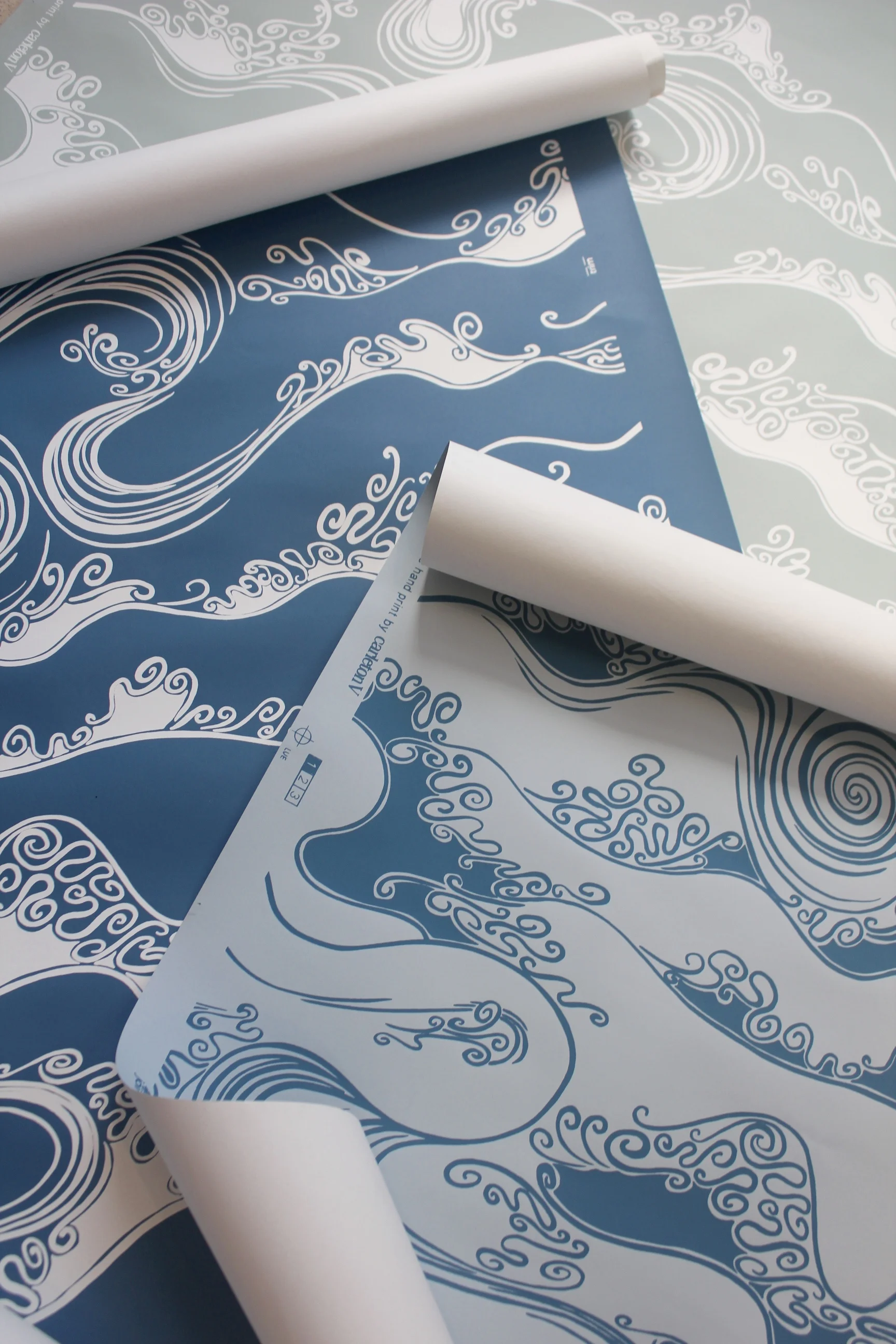 Kauai This stylized wave wallcovering is offered in 3 ocean inspired colorways.