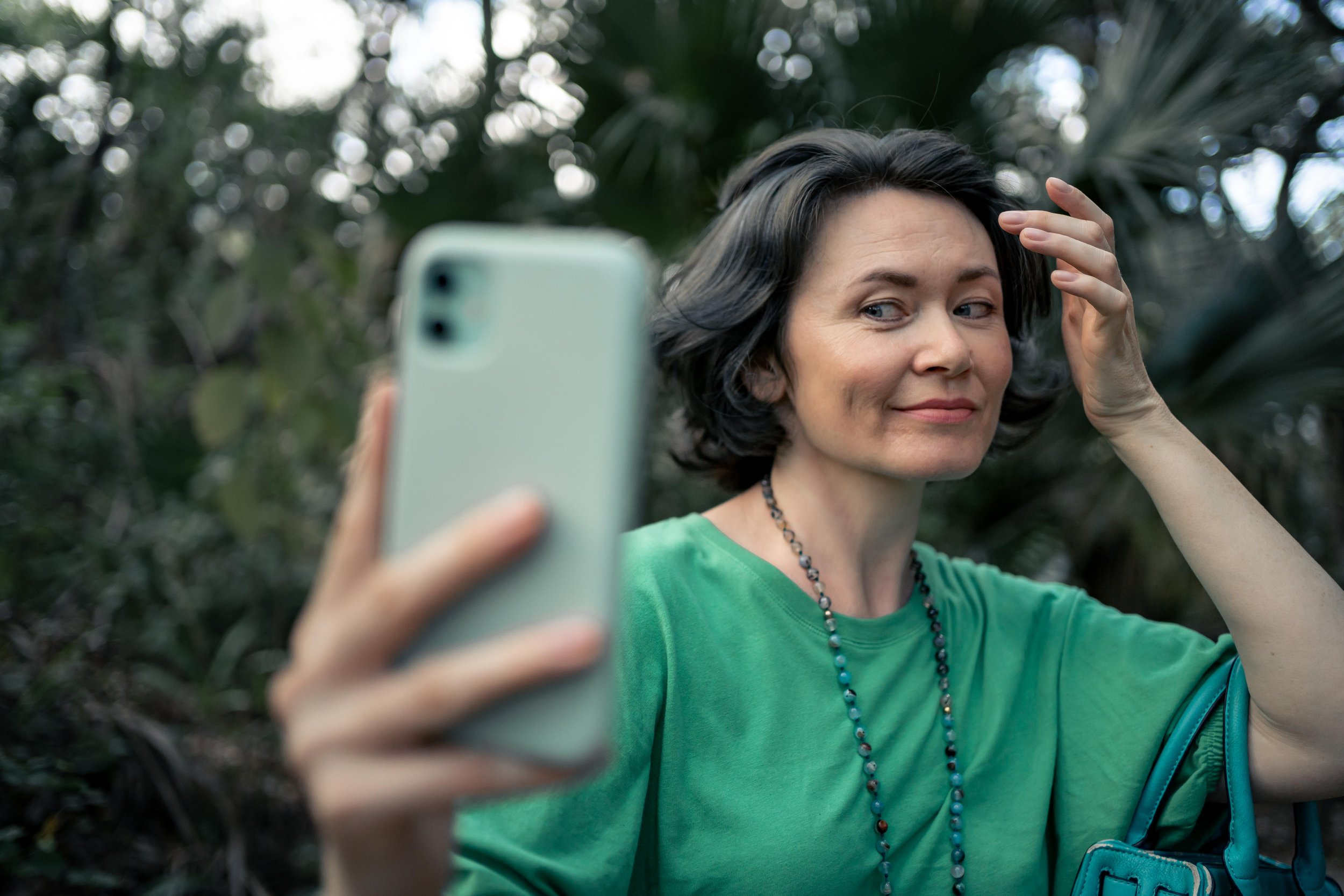 woman taking a selfie with her iphone