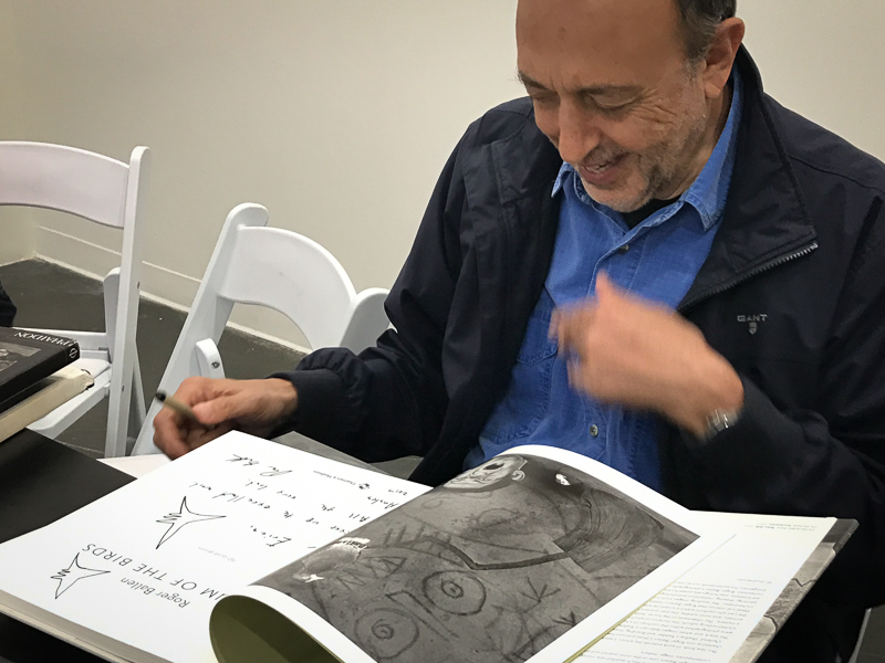 Roger Ballen signing his books - every book has its own kind of signature, each signature includes little drawings. 