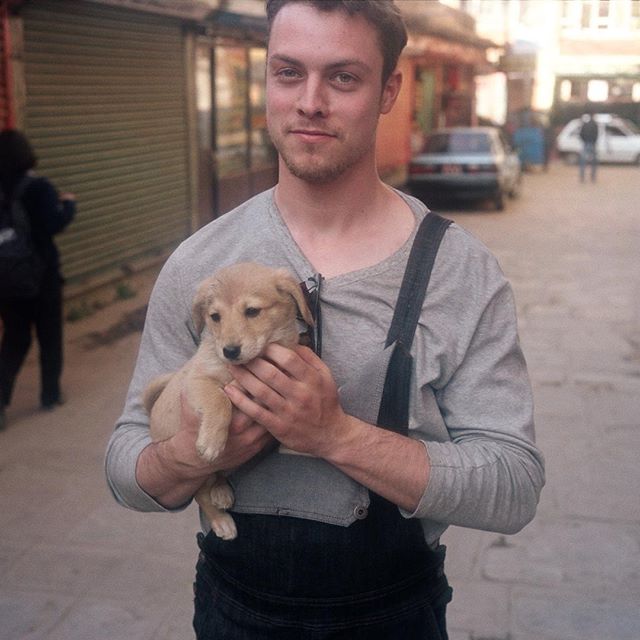 Wade found the cutest dog in Kathmandu.  #puppylove #doggymodelz #overalls #rousersoveralls