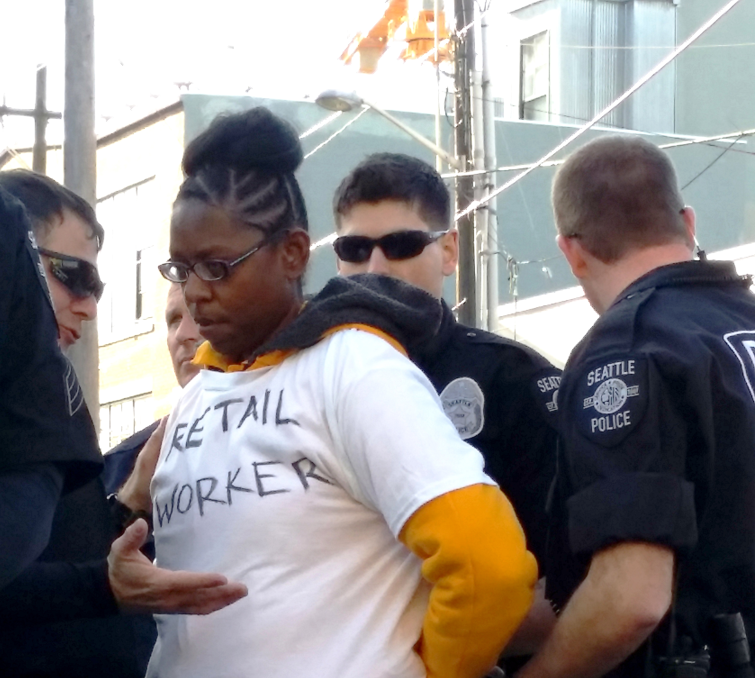 Candice Hemphill from the SouthCenter Macy’s stood up for all working people by speaking at an April 15 rally and then took an arrest as part of a planned civil disobedience to support workers.