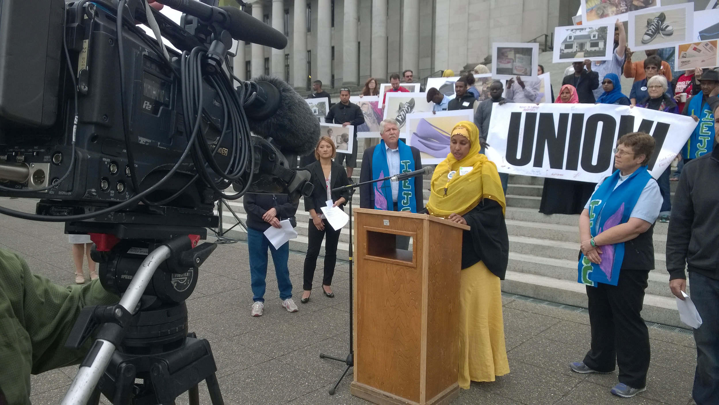 UFCW 21 member Shukri Hussien spoke on the steps of the Olympic court on June 26