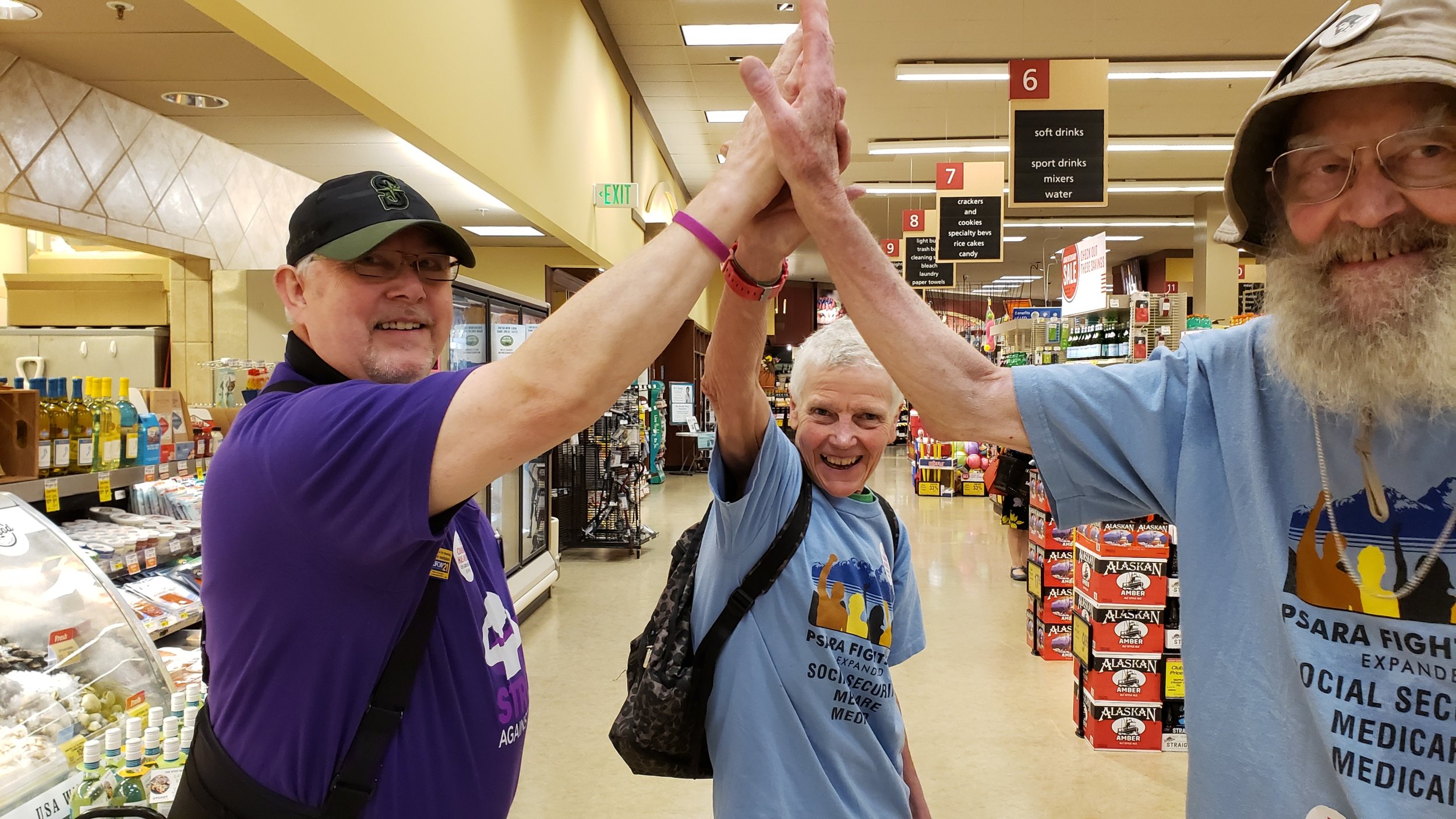 Pinehurst Safeway community worker high five 2.jpg