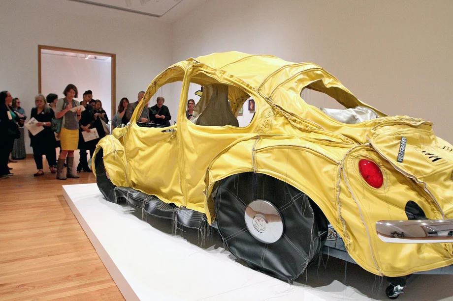 Mexican artist Margarita Cabrera's "Vocho (yellow)," a mixed media piece of hand-stitched vinyl, batting, thread and car parts depicting a VW Bug.