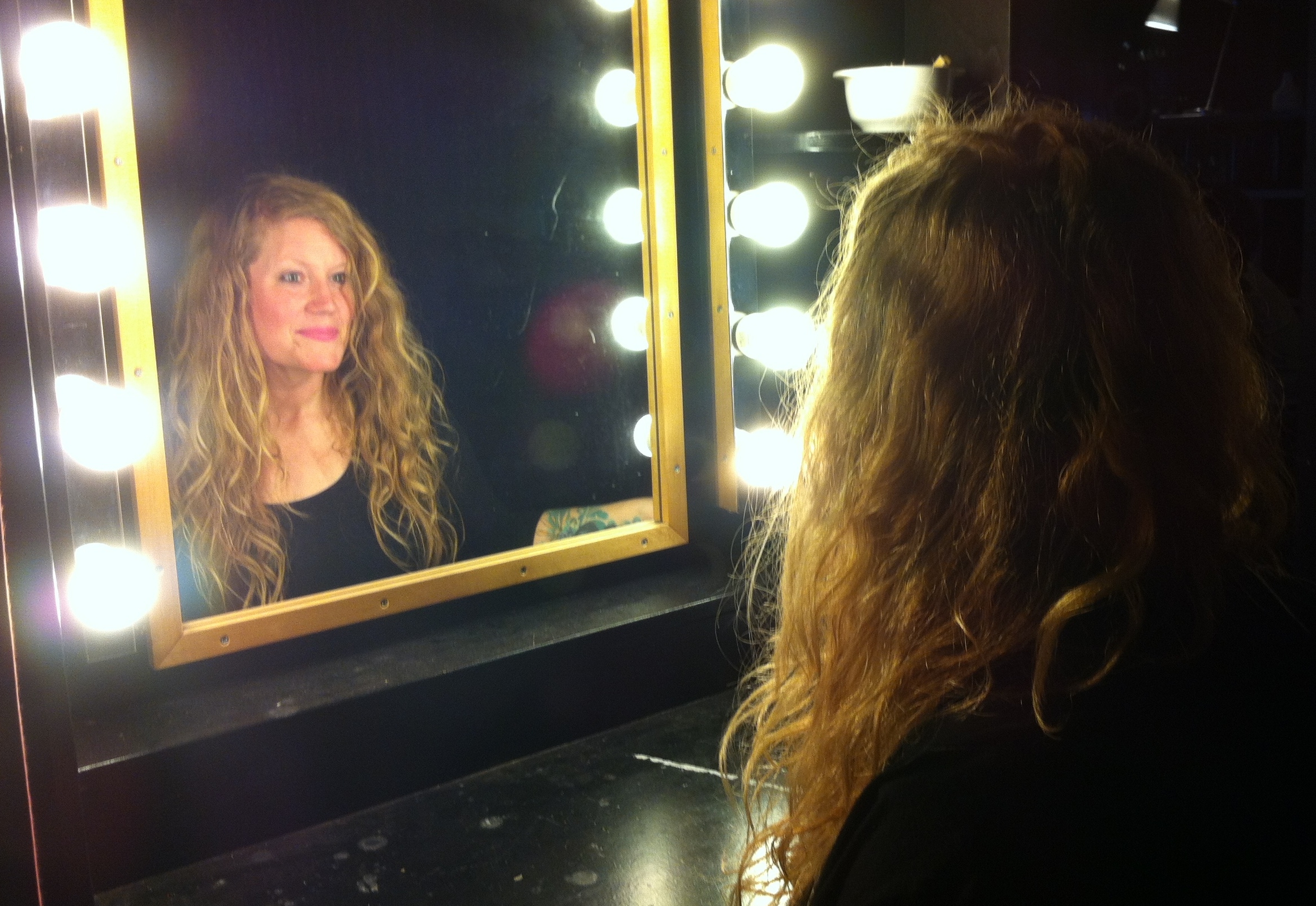 A_refelction_of_Lindsay_in_a_mirror_surrounded_by_lights