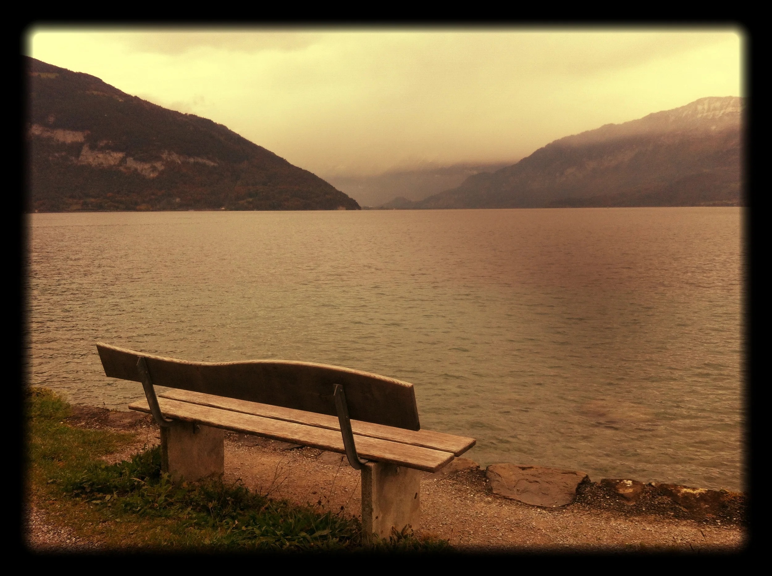 A_bench_on_a_lake_with_Mountains