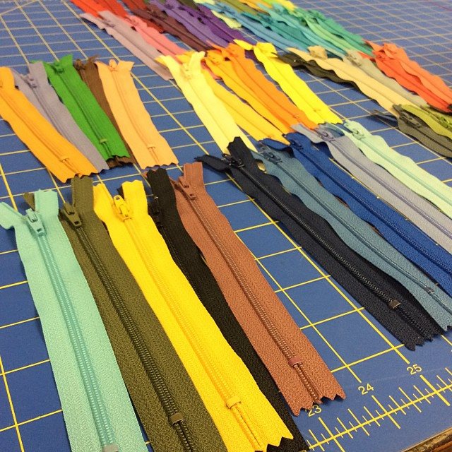 The next stage is coordinating the zippers, which I get from the lovely ladies at Sew Dayton , and fabric for the inner lining. As a thrift store junky, I am able to find lots of amazing fabrics that I bring home, wash and upcycle into their new form.