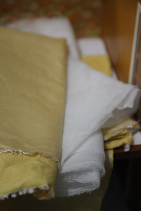 Lucky for me, I came across some heavy duty gold fabric with a lovely sheen for the bedspread and some light-weight sheer fabric for the windows. This will look SO much better. Guess I need to figure out a bed now!