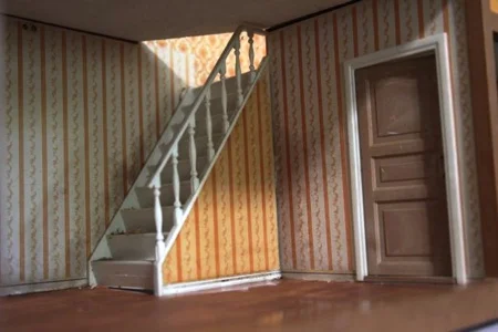 The floor in the Grand Room, the faux tile in the Hidden Room, as well as the carpet and wallpaper in the Sunny C room, were supposed to be salvaged.