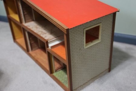 I played with dolls well into my teen years. I hide them in a trunk under my bed, a private collection of friends. I made clothes, accessories and furniture for them, but they nevery really had a home.