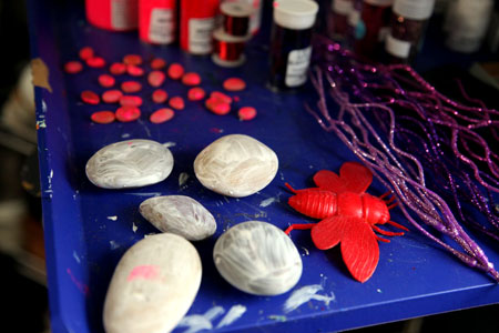 Gathering objects and putting some gesso on rocks.