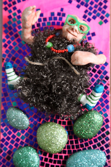 Painted socks, glasses and love beads, he is ready to jam.