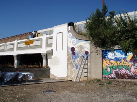 A view of the space with the active train line above.