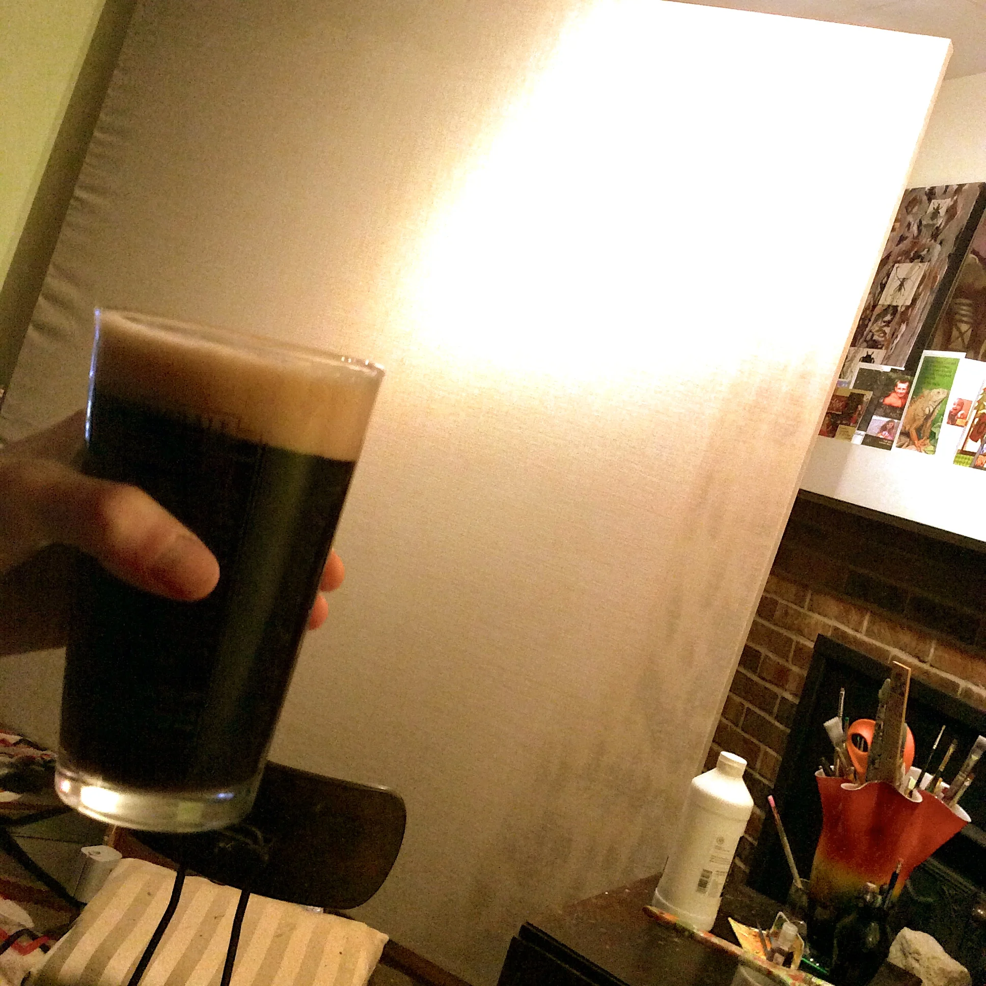 I began applying the clear gesso, but after screwing, stretching, pulling, and hammering, my sore hands told me a cold beverage would be more to their liking. They earned it!