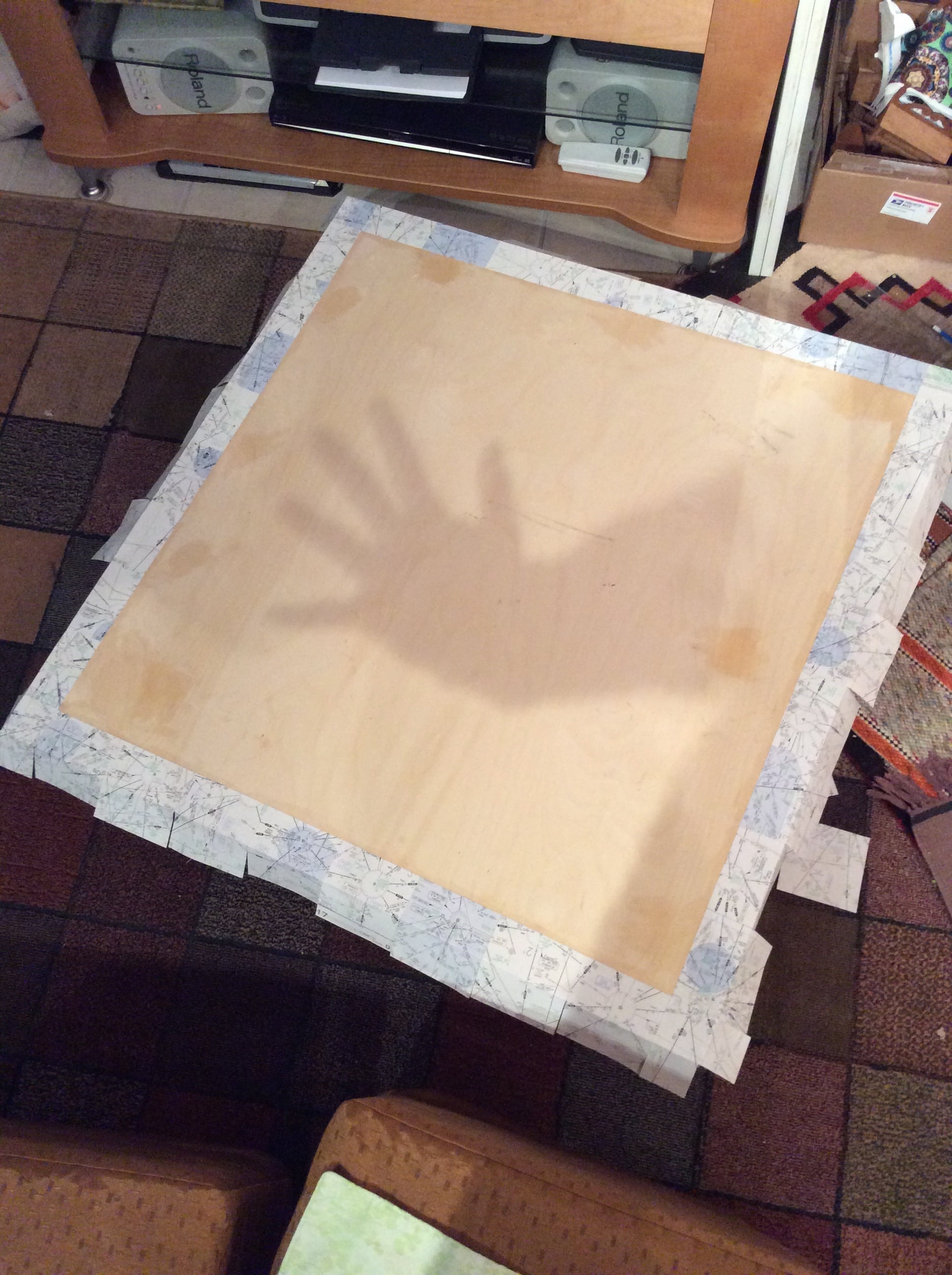 Gluing the white border down with guide marks to keep it level. 