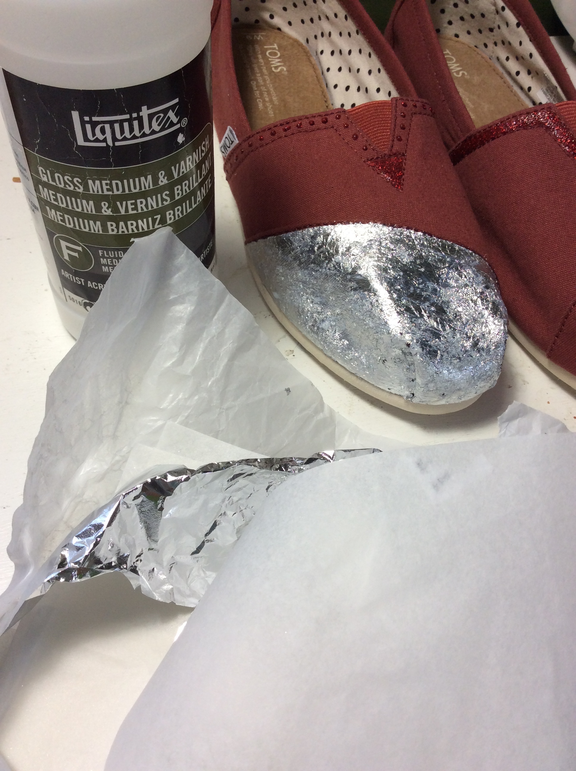 Adding a silver foil base to one of the toes. 