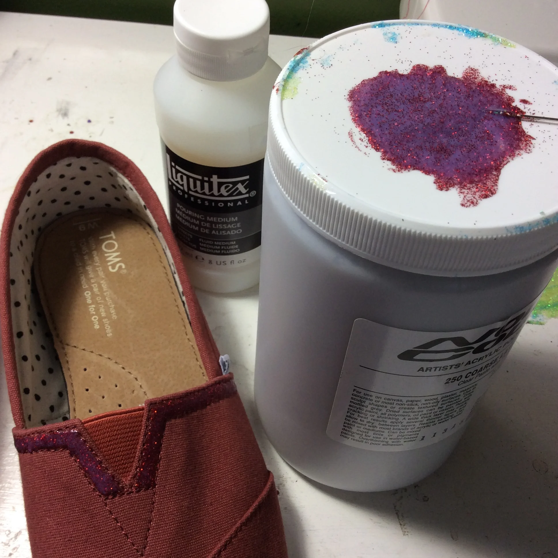 Some Pouring Medium mixed with fine glitter for a shimmery raised effect! 