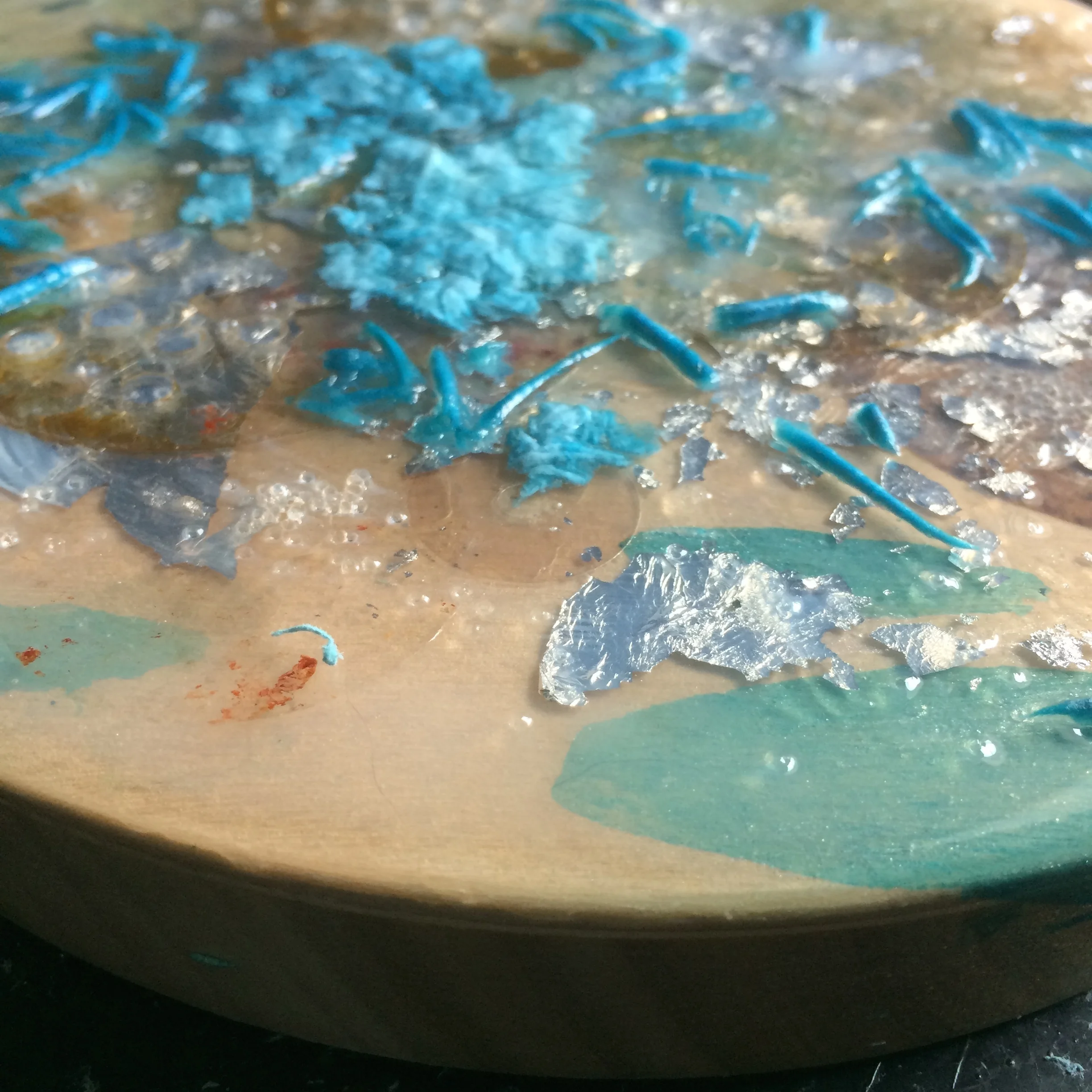 Embedding the paper waste into some pouring medium. 
