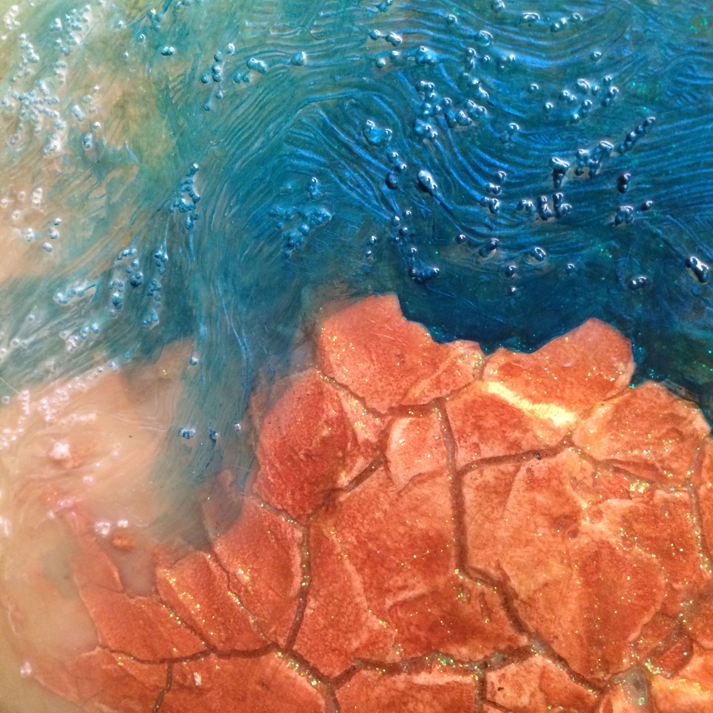 Crackle Medium 'island' with glass bead 'water.'