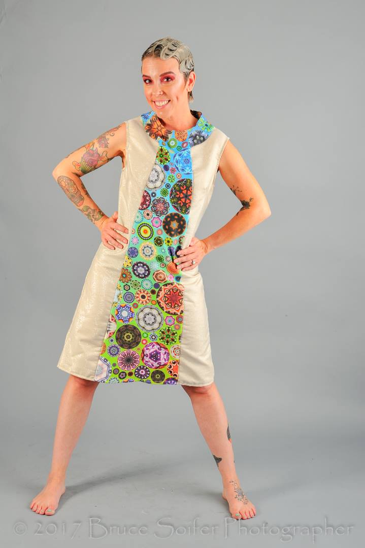Stephanie is wearing this mod dress, which was created using an altered pattern. The gold fabric was a thrift store find and the center/collar are my Kaleidoscope Circles II Rainbow design in organic cotton. 