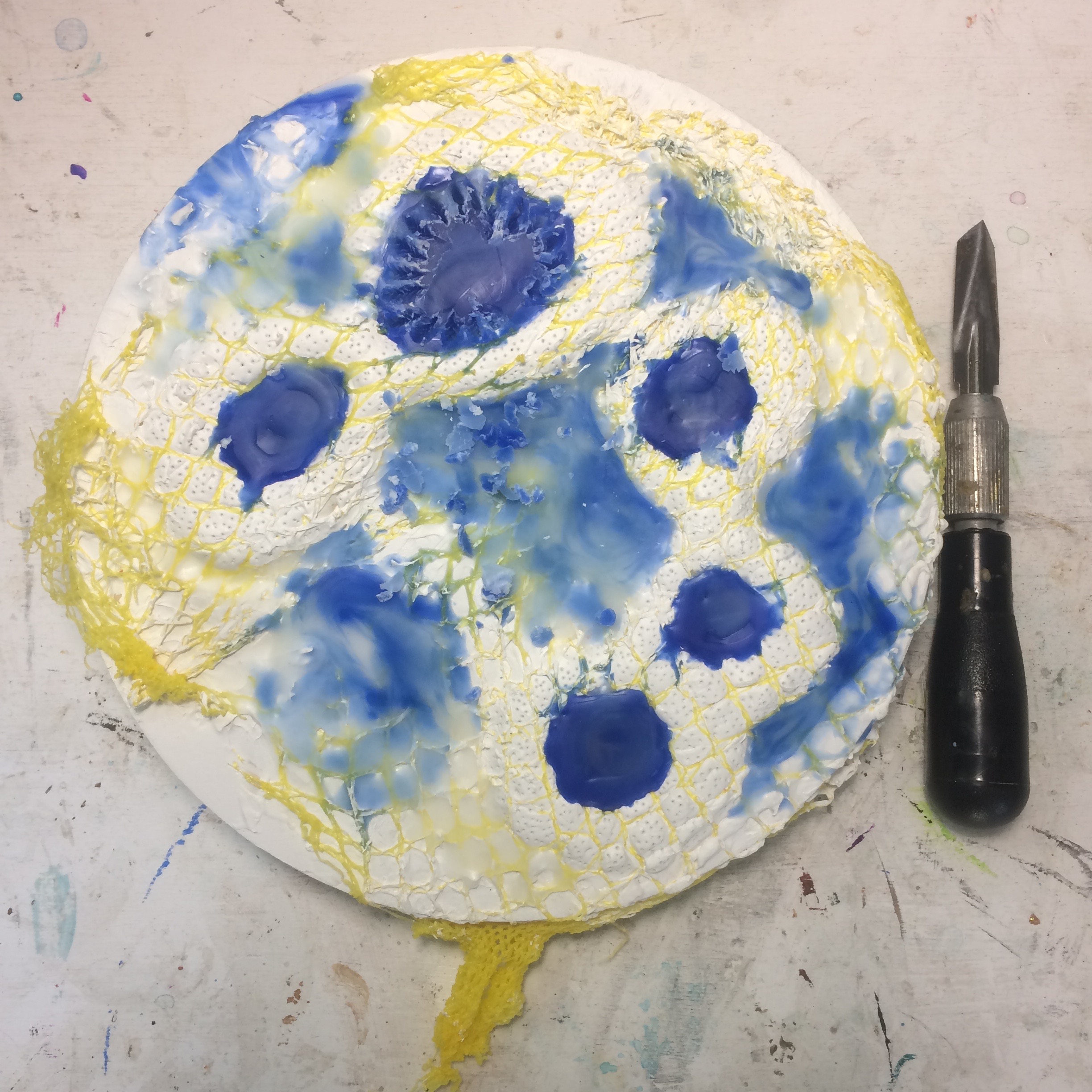 (A) Start, heavy gesso, poked with pin, lemon bag. (K) Blue wax, textured. 