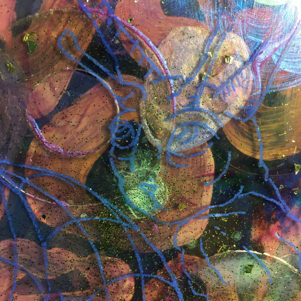 Detail of image transfer over pouring medium. Mica, paint and glitter visible.