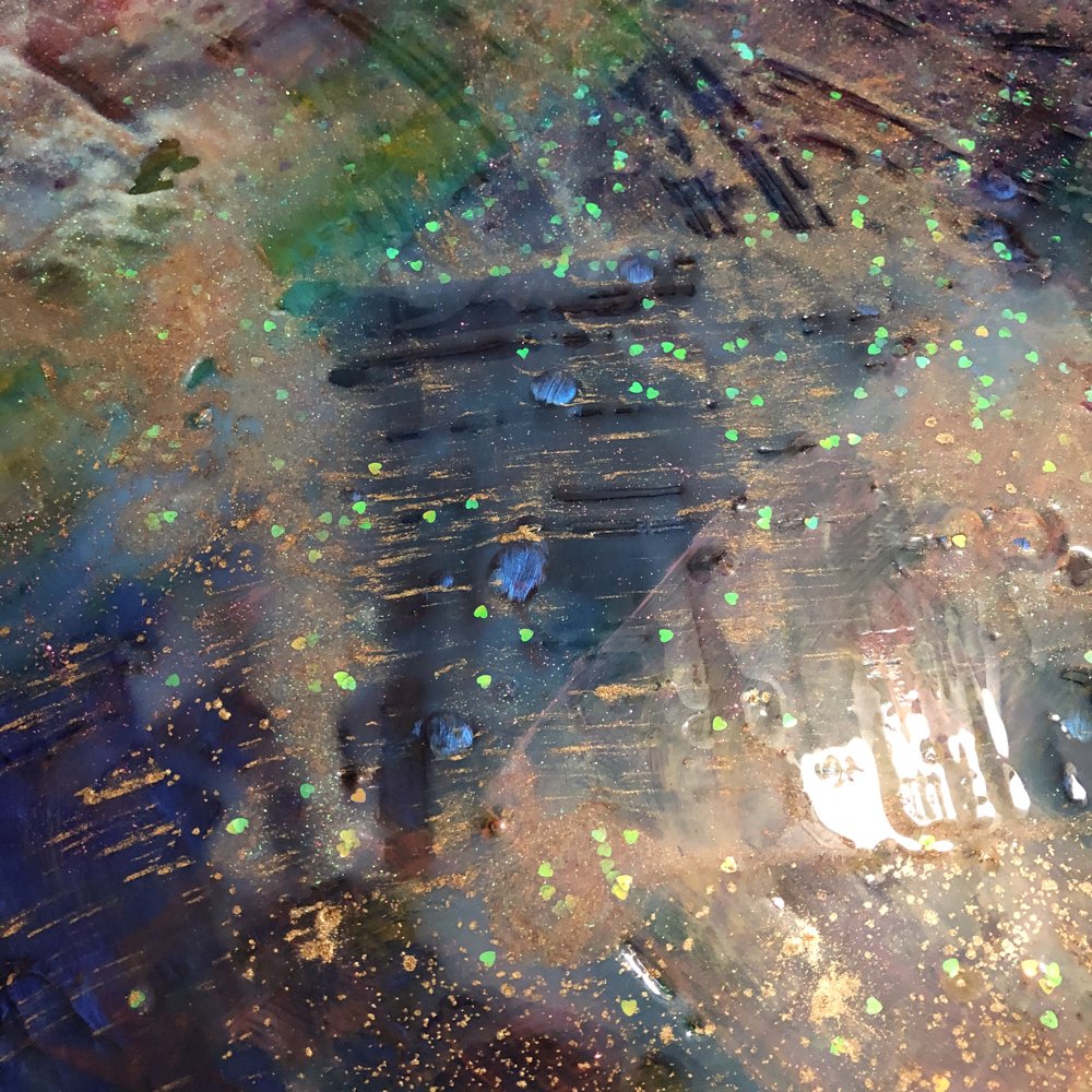 Detail with heart glitter and pouring medium.