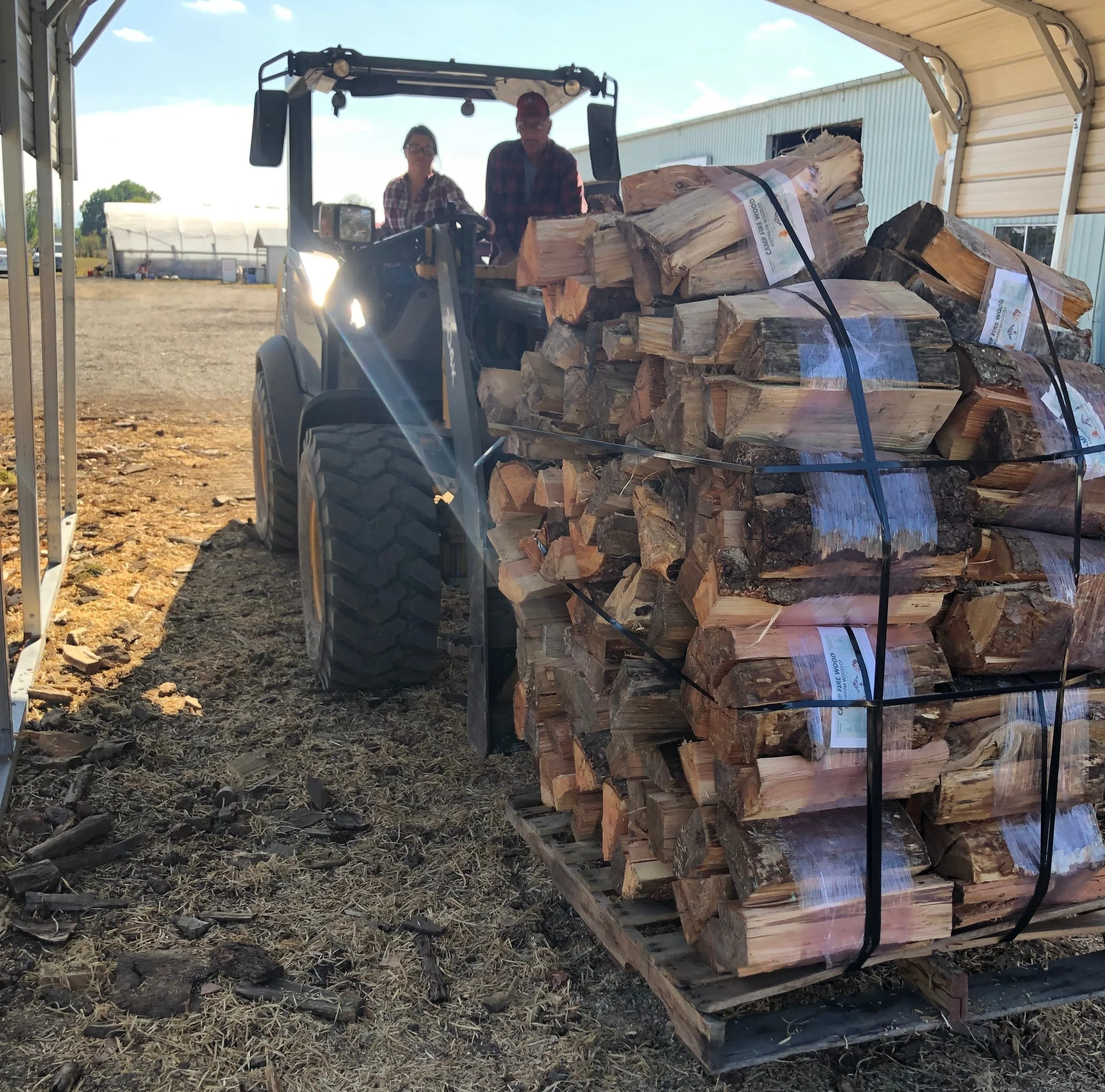 Farm Manager Emma Dean moving a load of Campfire Wood Bundles. Our Campfire wood is sold at 17 regional Coastal Stores, and select Linn County Campgrounds and at our woodlot .