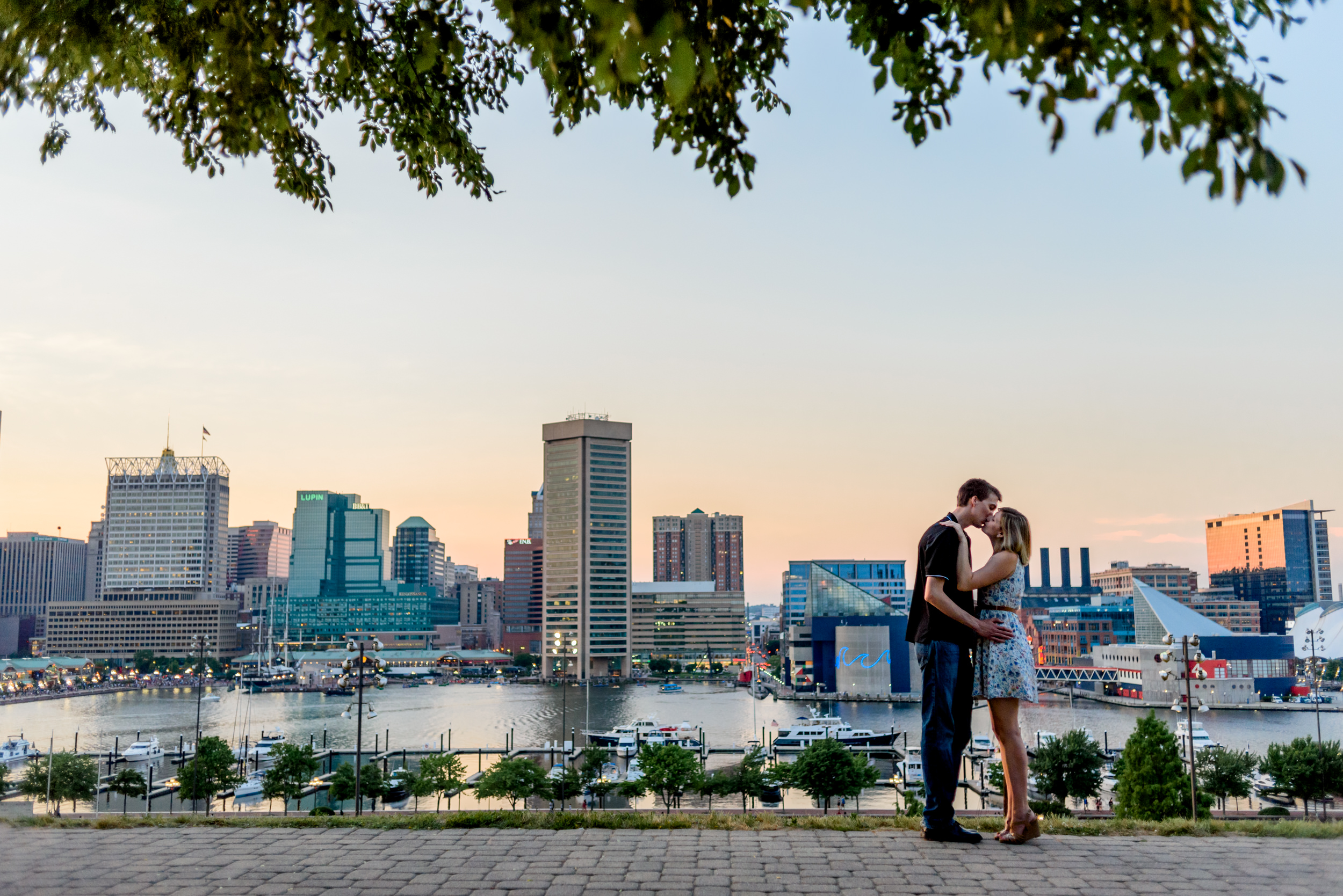 Federal Hill engagement photos during sunset overlooking the Baltimore skyline 