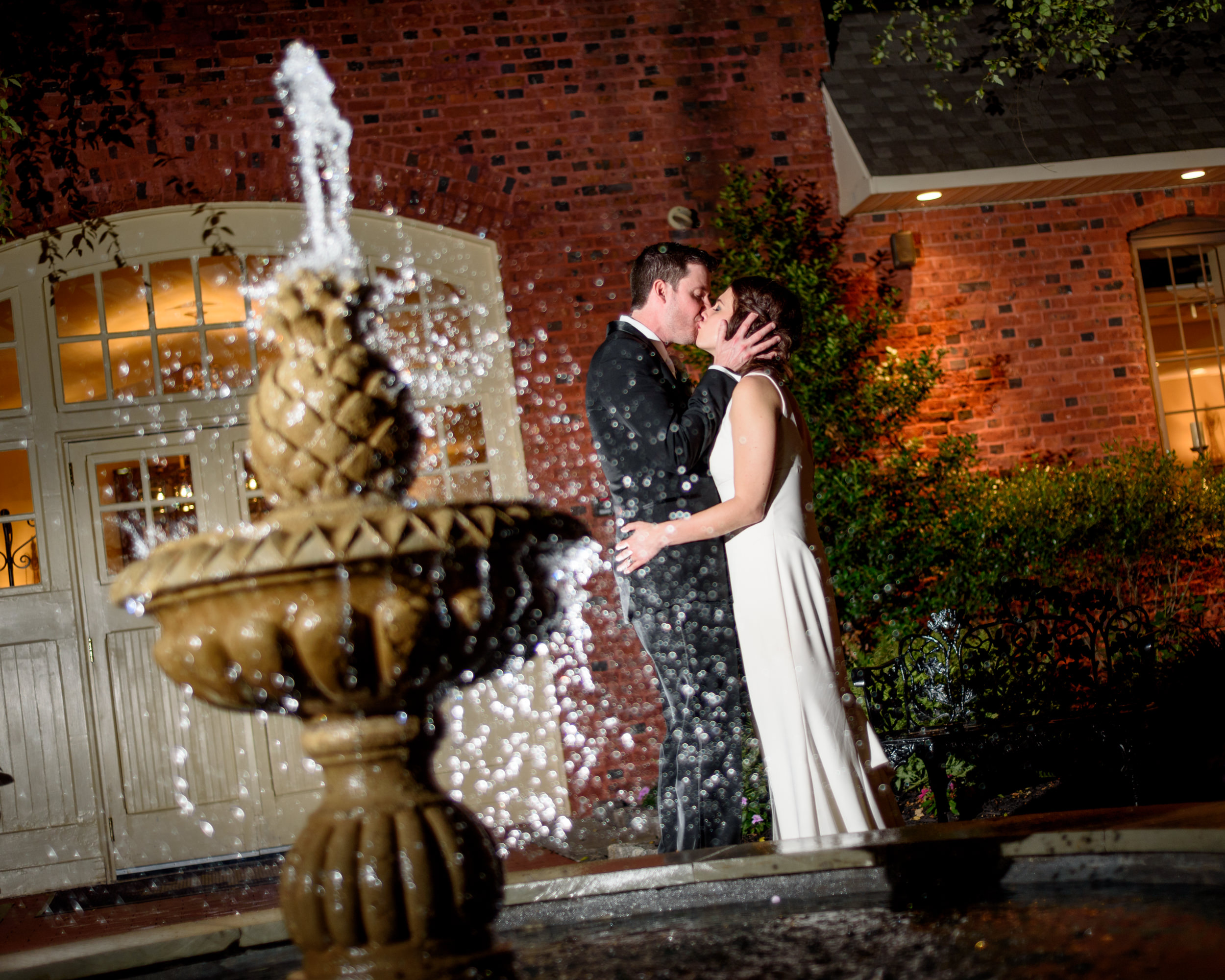 Talamore Country Club wedding photographer - bride and groom portrait near courtyard fountain