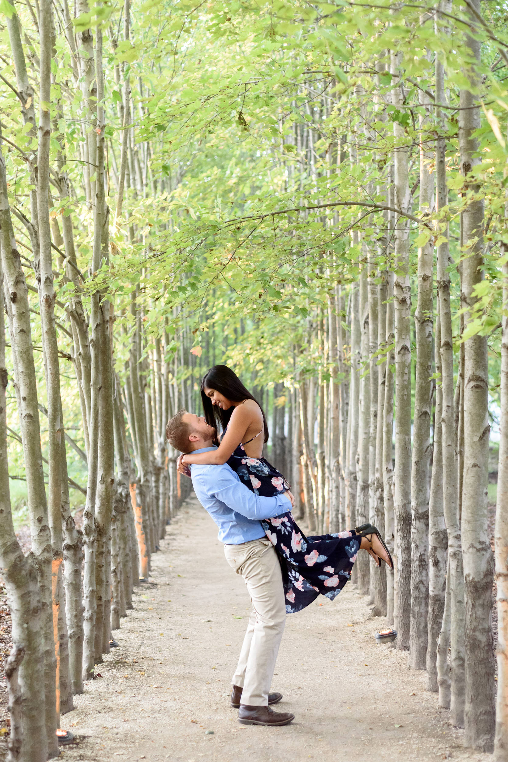 Engagement photos in the Red Maple Allée at Grounds for Sculpture