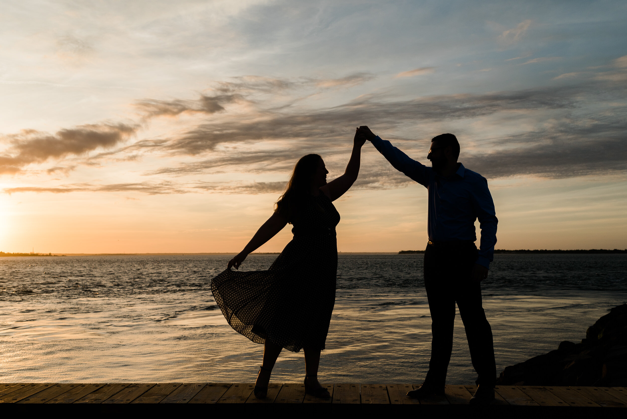 Silhouette engagement photo during sunset at Barnegat Lighthouse