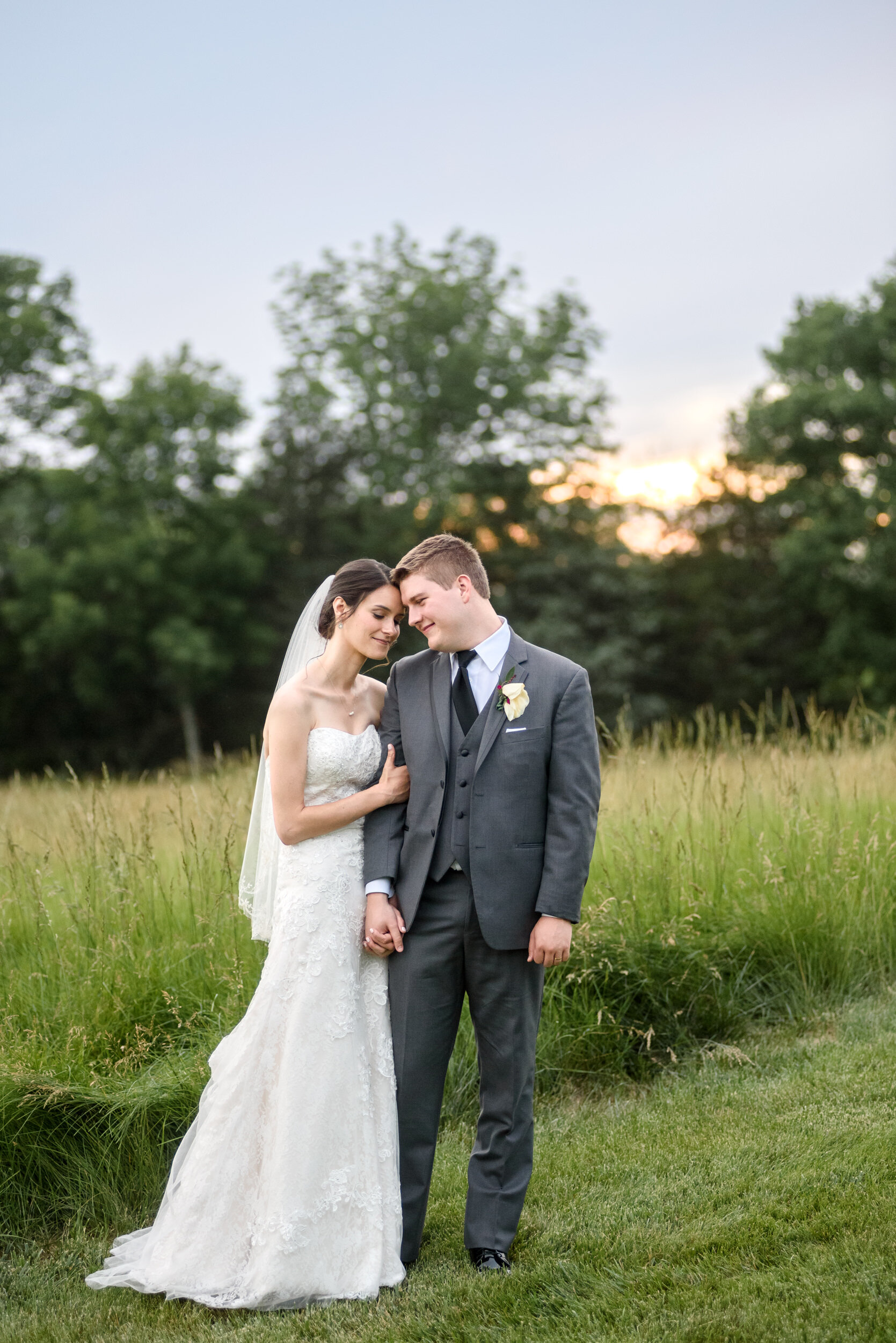 Bride and groom photos during sunset at the Loft at Sweet Water Country Club 