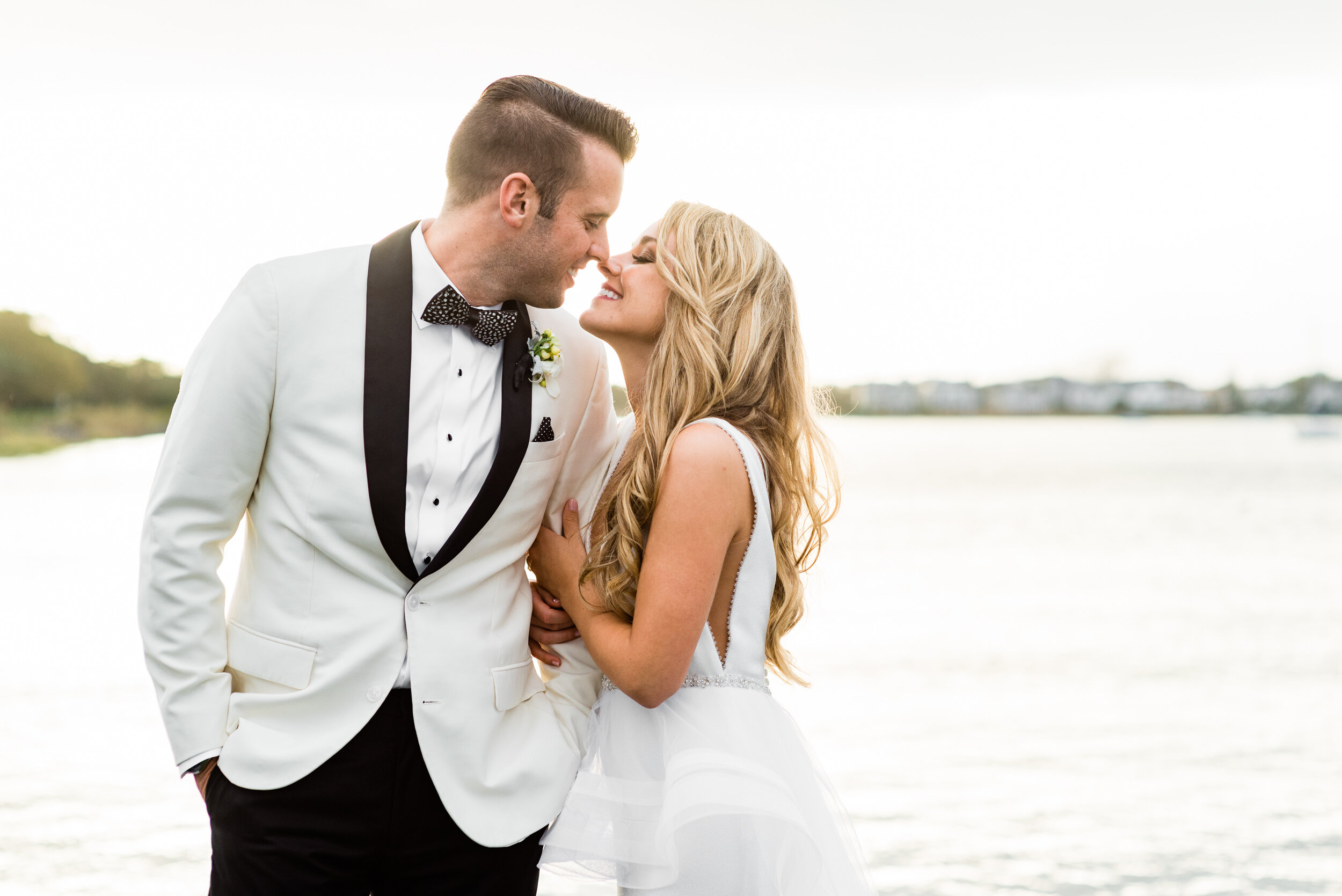 Bride and groom by the bay in Cape May - Cape May wedding photos