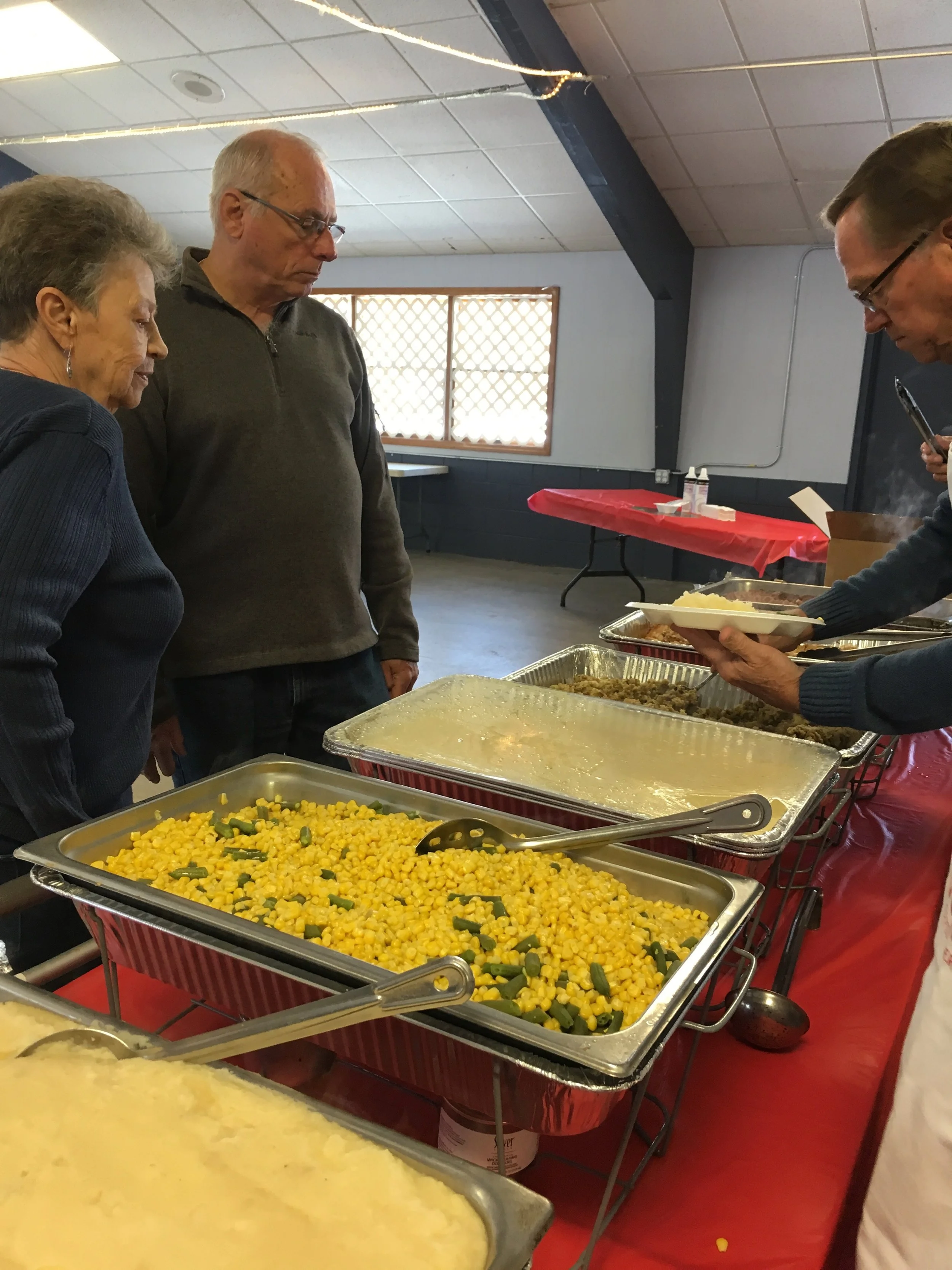 Serving Christmas dinners at Christmas Day, Inc., Christmas Day