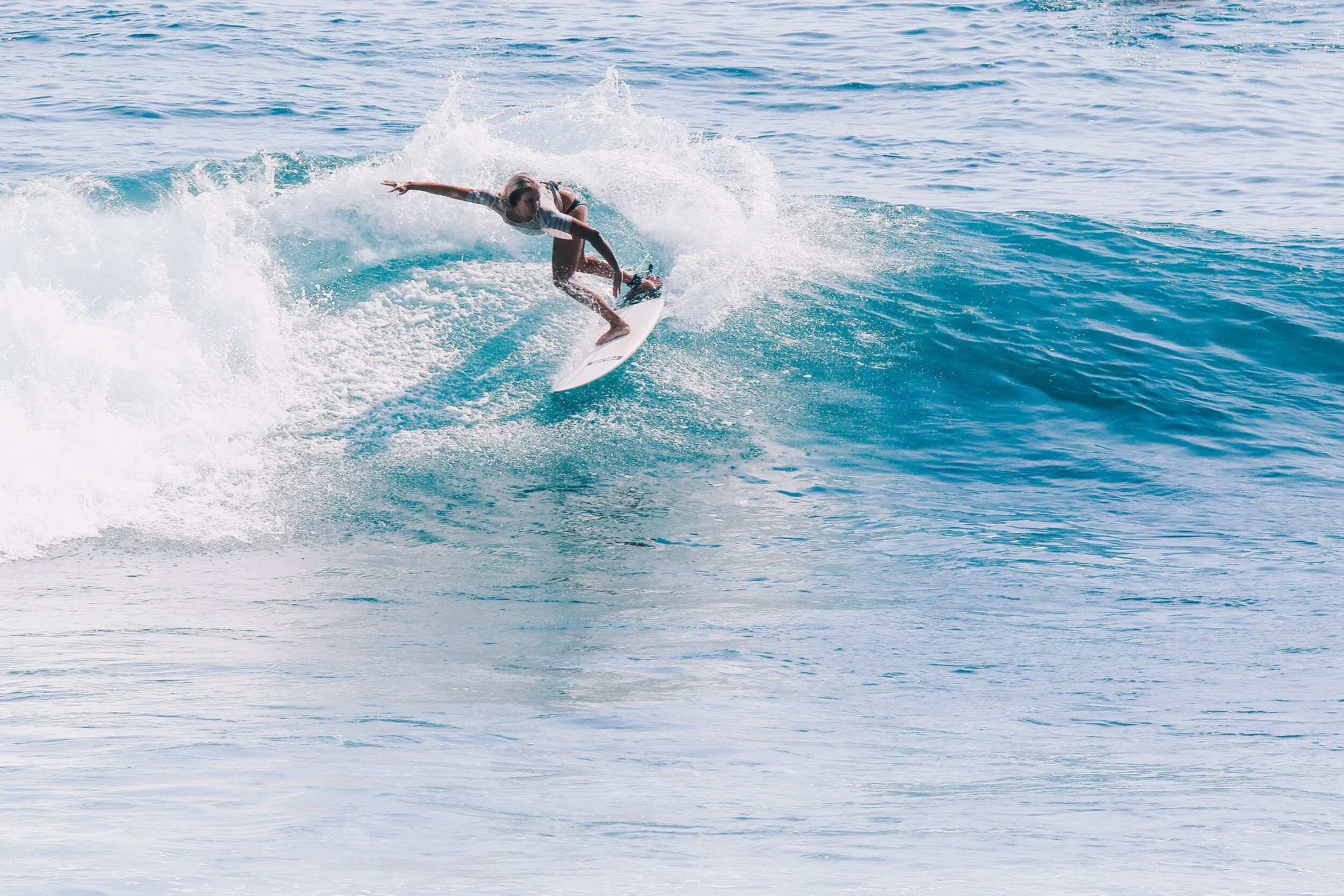 I love surfing! Above you can see me enjoying a wave in Bali ‘18, taken by a local man and edited by me. Below Hanging with my favourite twin fin.