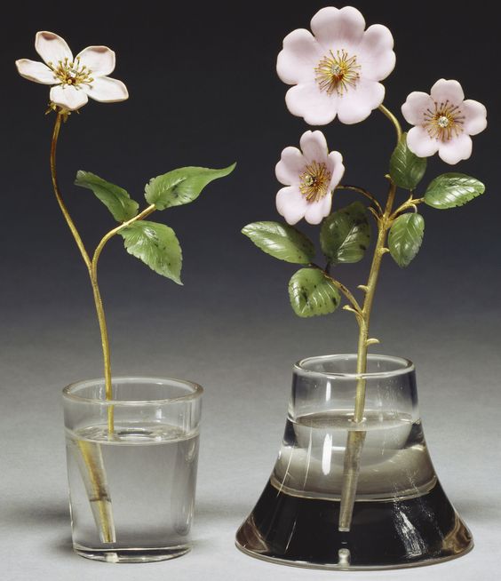 Two Faberge studies of primroses in enamel, gold and jade.