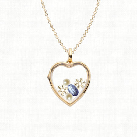 Contemporary locket by Loquet, filled with winter symbols.