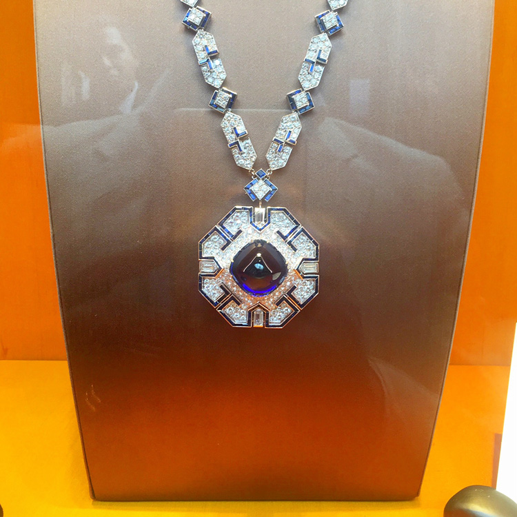 The boldly designed geometric sautoir, featuring an impressive Burmese sugar loaf sapphire just shy of 53 carats.