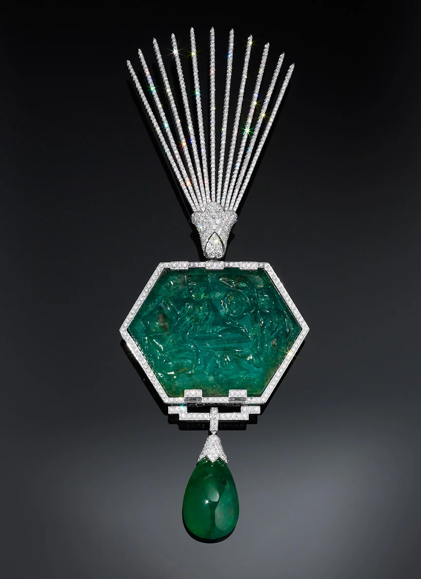  A magnificent turban ornament by Cartier made in the 1920s. The central emerald was an Indian heirloom emerald reset into a neo Indian design that successfully married the best elements of modern Art Deco and traditional Moghul design.