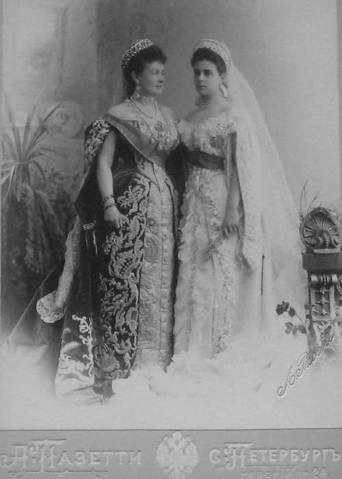 The Grand Duchess Vladimir wearing the tiara she commissioned from Bolin. She is photographed with her only daughter, Elena, who married Prince Nicholas of Greece. She sold the tiara to Queen Mary in 1921. Her daughter Marina married the Queen's uncle, the Duke of Kent. Note the grandeur and sumptuousness of their Court dress.